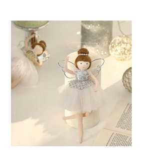 Detailed close-up of a Christmas ballet angel doll featuring silver sequins and white tulle