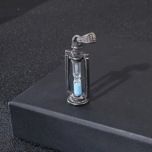 Vintage hourglass pendant in bronze stainless steel with vibrant blue sand detail