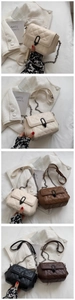 Detail view of quilted leather crossbody bags with metal hardware and chain straps