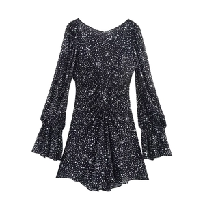 Polka dot long sleeve mini dress with flared cuffs and central pleats in black and white