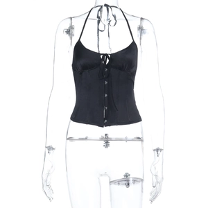 Detail of black satin corset top with halter neck straps and front button closure