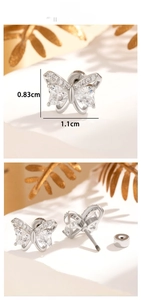 Detailed view of silver butterfly earring with heart-shaped zircon and screw back