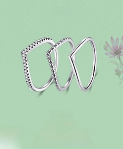Detailed view of three stackable S925 sterling silver V-shaped wishbone rings with pavé cubic zirconia