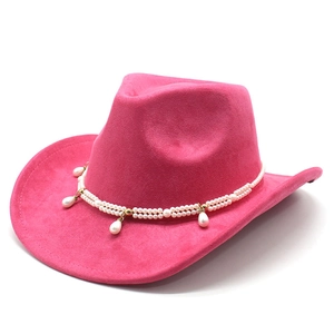 Detail of fuchsia cowboy hat with double-row white pearls and teardrop pearl charms