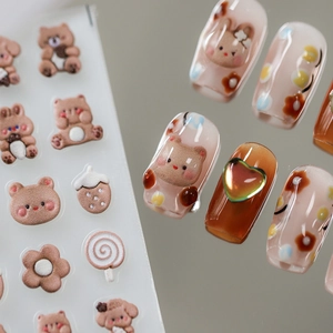 3D embossed nail stickers featuring cute cartoon bears, rabbits, and cream-colored floral patterns