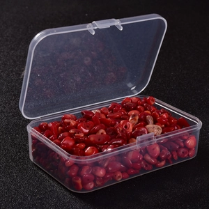 Red irregular crystal stone beads set in a clear plastic organizer box for DIY jewelry