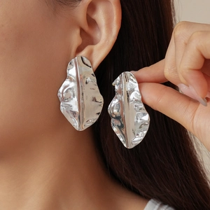 Modern irregular shell texture silver earrings with a bold molten lava metallic finish