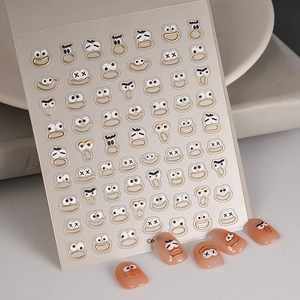 Macro view of 3D gold embossed cartoon expression nail art stickers on soft pink nails