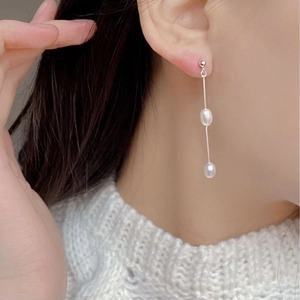 Detailed close-up of S925 silver long tassel earrings with natural freshwater pearls