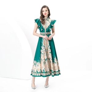 Resort style dark green paisley print maxi dress with ruffle sleeves and belted waist