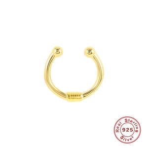 Macro detail of a 925 sterling silver golden nose ring with textured beads and certification