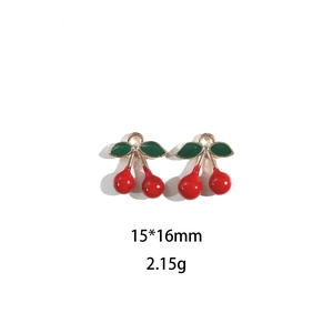 Detail of 15x16mm cherry alloy pendants with red enamel finish and green leaves