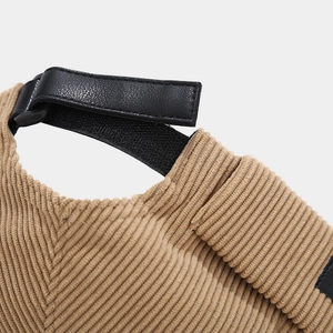 Adjustable back detail of khaki corduroy docker hat with leather strap and metal buckle