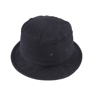 Detail of black denim bucket hat showing metal ventilation eyelets on white background