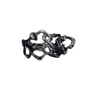 Detail of unique irregular hair claw clip with a glossy liquid-like abstract structure