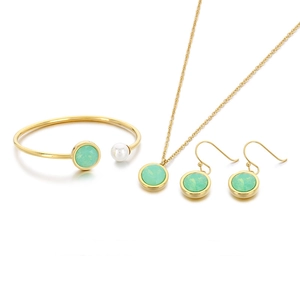 Elegant gold stainless steel jewelry set with green zircon stones and white pearls