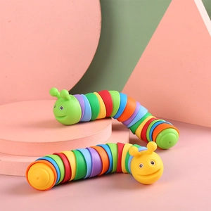 Rainbow slug fidget toy for stress relief with colorful segments and a cute face