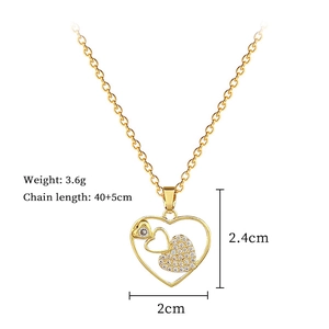 Detail view of heart pendant with size and weight specifications in gold titanium steel