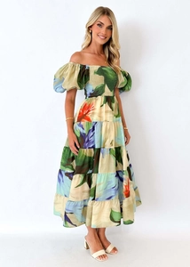 Detail view of the floral off-shoulder maxi dress featuring puffy sleeves and ruffled hem