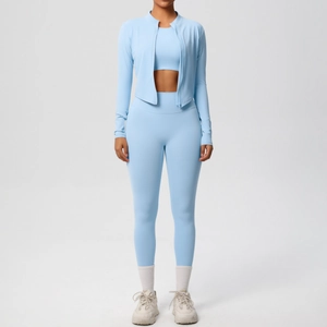 Three-piece light blue athletic yoga set featuring jacket, sports bra, and high-waist leggings