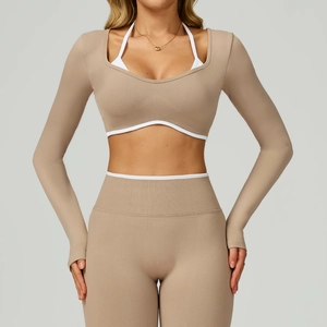 Detail of seamless yoga crop top with contrast piping and thumbhole sleeves in latte brown