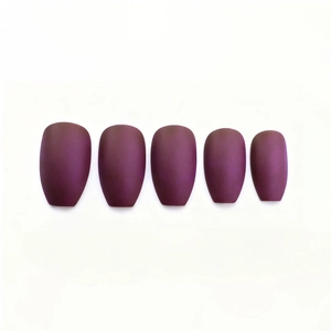 Detailed view of five long coffin-shaped matte burgundy press-on nails on white background