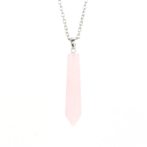 Macro detail of natural rose quartz hexagonal prism pendant on silver chain