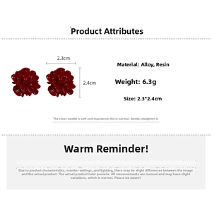 Detailed view of red pleated flower earrings with silver needles and size measurements