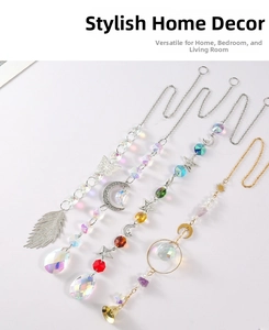 Detailed view of four crystal suncatchers with metal moon, star, and butterfly charms