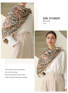 Detail showing the baroque floral pattern and glossy silk texture of this square scarf