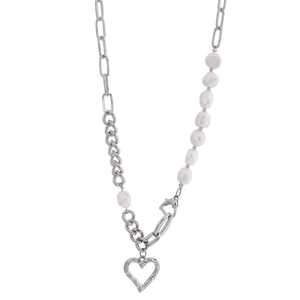 Elegant asymmetrical pearl and silver metal necklace with hollow heart pendant for women