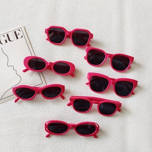 Flat lay of multiple rose pink fashion sunglasses in various geometric frame styles