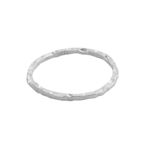 Minimalist S925 sterling silver ring featuring irregular hammered texture on white background