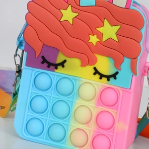 Detail of rainbow unicorn pop-it fidget bag showing silicone bubbles and starry decoration
