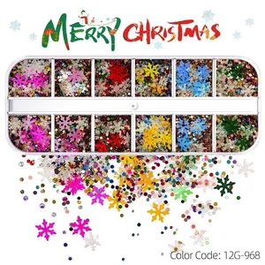 Detail view of 12-grid Christmas nail art glitters featuring colorful snowflake shapes