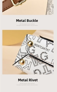 Detailed shot of golden hardware buckles and rivets on a white cartoon tote bag