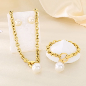 Golden stainless steel jewelry set featuring round pearls and OT buckle chain design