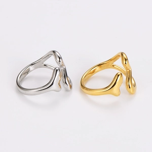 Minimalist hollow heart open rings in gold and silver finishes on a clean white background