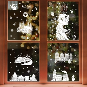 Stickers de Noël blancs avec Père Noël rennes et flocons sur vitre de fenêtre