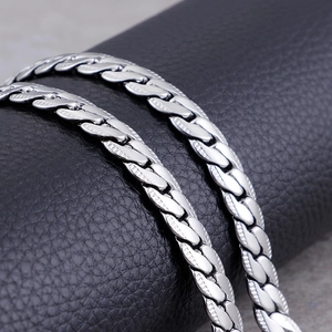 Polished silver stainless steel NK curb chain necklace with engraved details for men