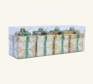 Detail view of 4-piece gold Christmas gift box ornaments with snowflakes and green ribbons