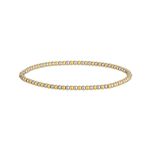 Close-up of a two-tone gold and silver beaded stainless steel stretch bracelet