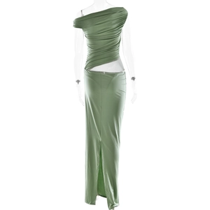 Detail of green one-shoulder maxi dress featuring ruched texture and waist cutout design
