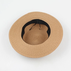 Handwoven straw sun hat with inner sweatband and adjustable drawstring on white background