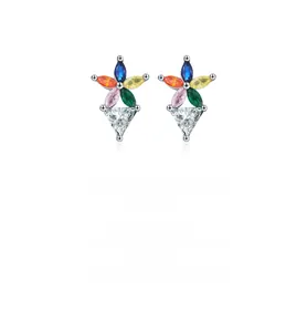 Macro view of flower stud earrings featuring colorful marquise-shaped cubic zirconia crystals
