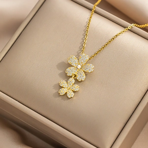 Luxury titanium steel necklace with triple-petal flower zircon pendant and pearl