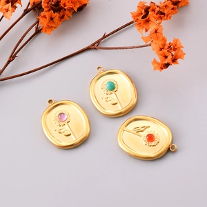 Oval stainless steel sunflower pendants with colorful floral relief centers in gold