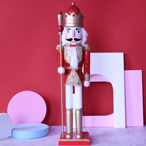 Detail of 62cm red and gold glitter wooden nutcracker king standing on a festive base