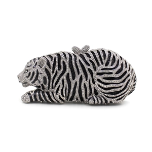 Exquisite detail of tiger clutch with hand-set sparkling crystals and bow clasp