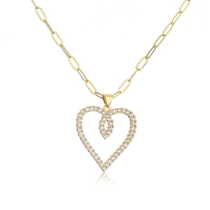 Close-up of golden heart pendant necklace with clear crystals on paperclip chain
